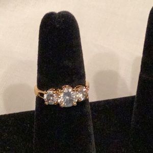 Beautiful three stone cubic zirconia gold tone ring.  Worth a lot more!